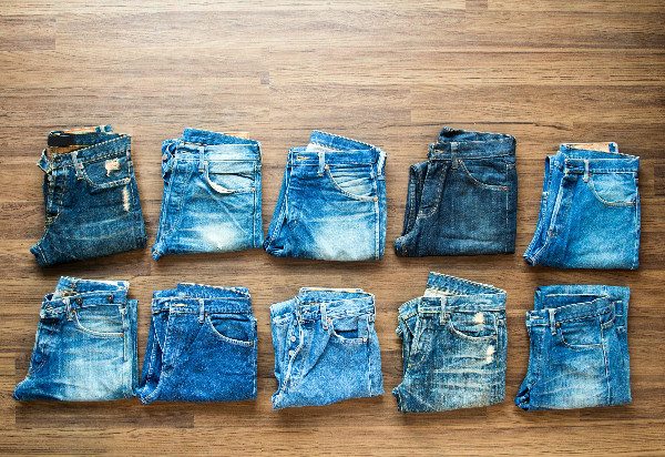 You can unshrink clothes like denim jeans using warm water and ingenuity.